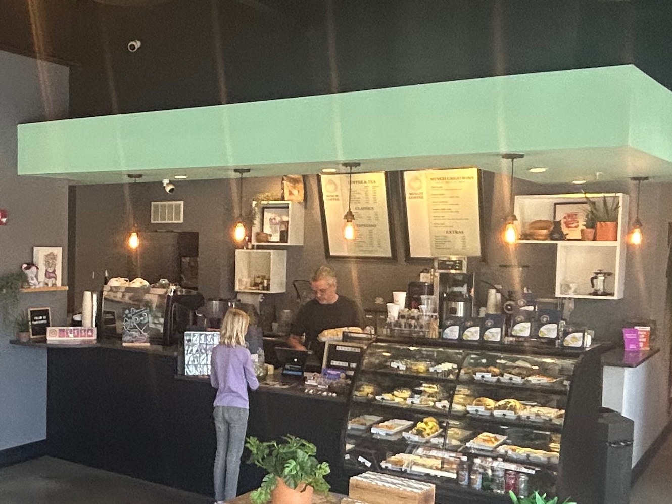 A barista at work at Minch Coffee in the cat café
